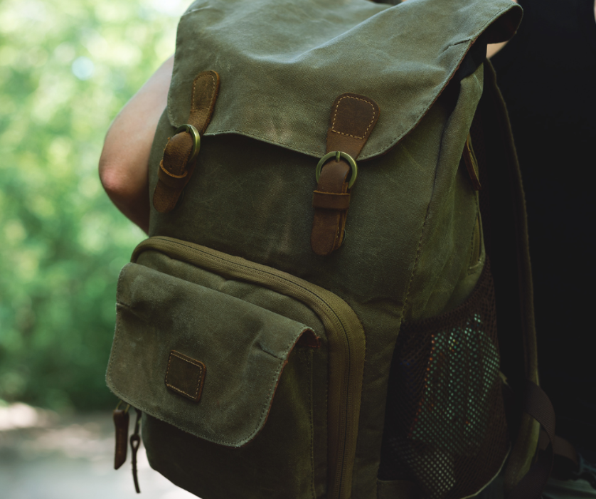 wearing backpack on single shoulder 